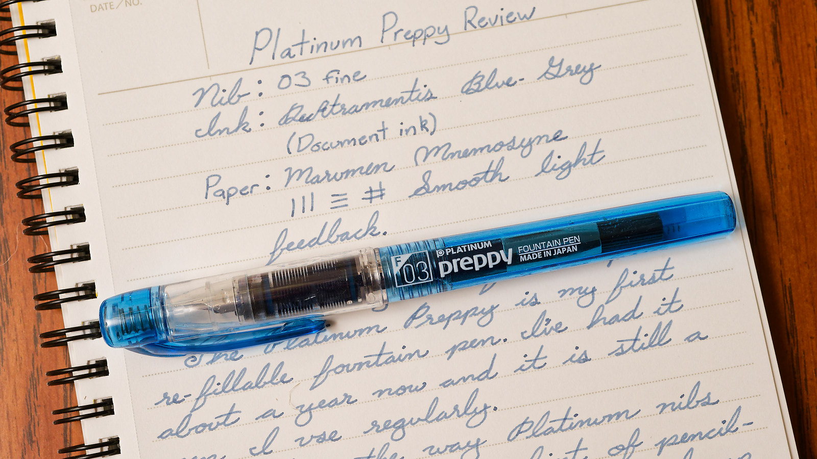 A platinum preppy fountain pen on top of a notebook