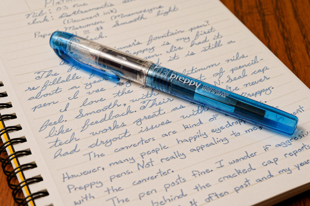 A photo showing a Platinum Preppy up close with a silver converter inside.