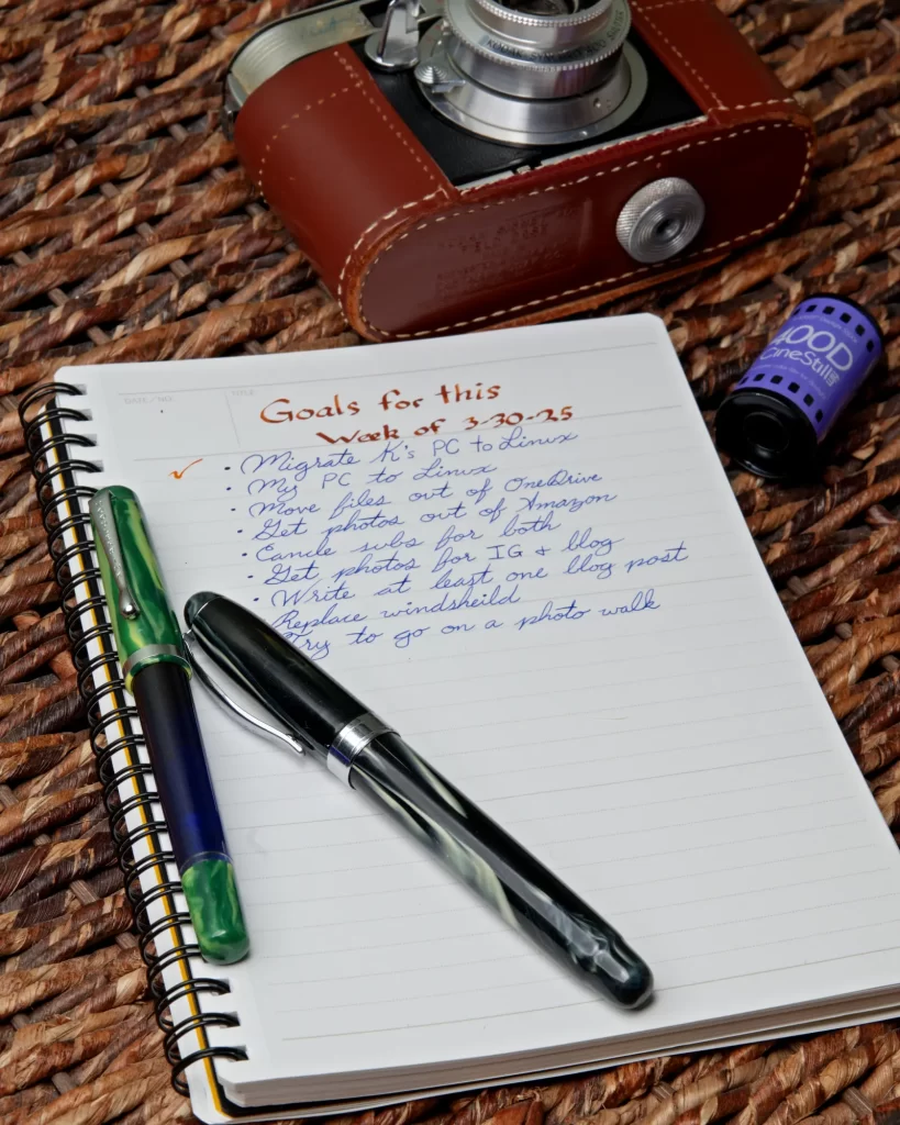 Noodler's Konrad and Ahab fountain pens resting on a notebook with a to-do list written on it with said pens.
